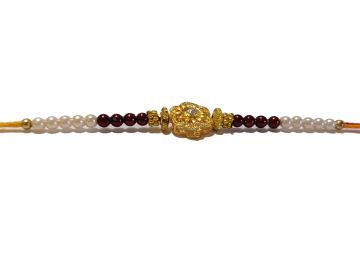 RAKHI Designed With a Golden Flower and Pink Beads for Brother