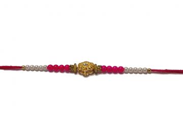 RAKHI Designed With a Golden Flower and Pink Beads for Brother