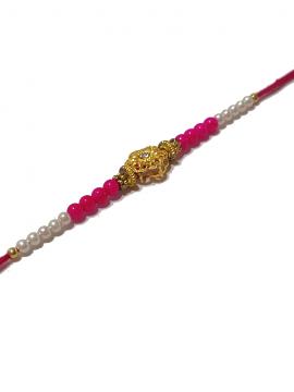RAKHI Designed With a Golden Flower and Pink Beads for Brother