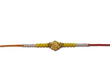 RAKHI Designed With a Golden Flower and Yellow Beads for Brother RAKHI Designed With a Golden Flower and Yellow Beads for Brother