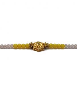 RAKHI Designed With a Golden Flower and Yellow Beads for Brother RAKHI Designed With a Golden Flower and Yellow Beads for Brother