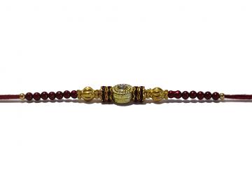 Traditional RAKHI Designed With Brown Colored Stones and Beads for Brother Traditional RAKHI Designed With Brown Colored Stones and Beads for Brother