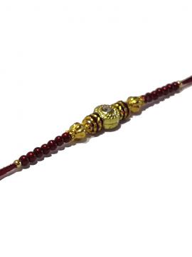 Traditional RAKHI Designed With Brown Colored Stones and Beads for Brother Traditional RAKHI Designed With Brown Colored Stones and Beads for Brother