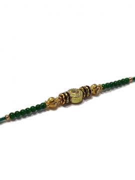 Traditional RAKHI Designed With Green Colored Stones and Beads for Brother Traditional RAKHI Designed With Green Colored Stones and Beads for Brother