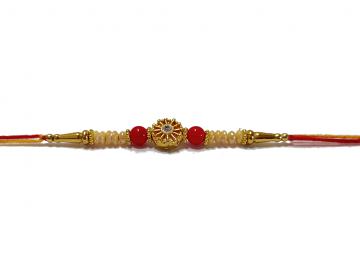 RAKHI with Beautiful White Pearls mixed in with Red Beads and a Diamond RAKHI with Beautiful White Pearls mixed in with Red Beads and a Diamond