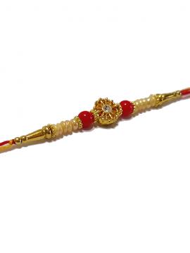 RAKHI with Beautiful White Pearls mixed in with Red Beads and a Diamond RAKHI with Beautiful White Pearls mixed in with Red Beads and a Diamond