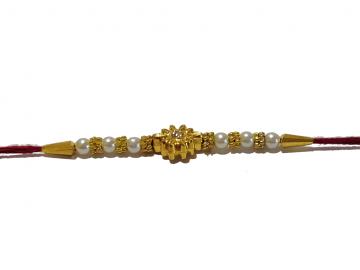 RAKHI Crafted in Golden Sun Like Flower With White Beads RAKHI Crafted in Golden Sun Like Flower With White Beads