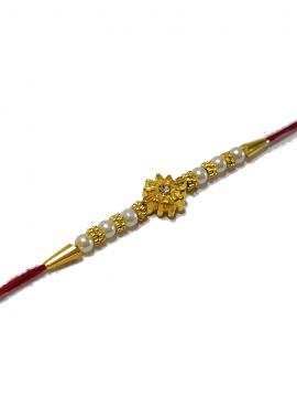 RAKHI Crafted in Golden Sun Like Flower With White Beads RAKHI Crafted in Golden Sun Like Flower With White Beads
