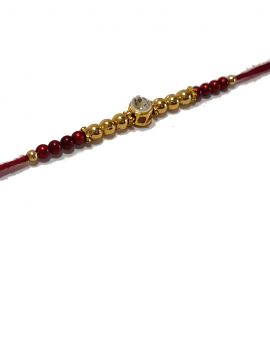 Diamond RAKHI Designed With Golden and Brown Beads