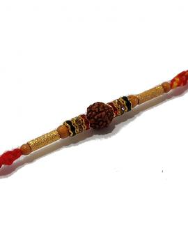 Traditional RAKHI Crafted in Gold W/ Rudraksha and Diamonds Traditional RAKHI Crafted in Gold W/ Rudraksha and Diamonds