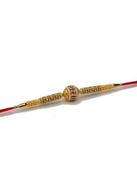 Designer RAKHI In Gold W/ American Diamonds and White Beads