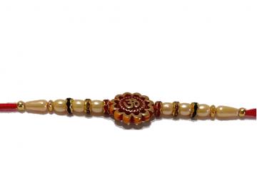 Om Carved RAKHI With Beads and Diamonds on Golden Rings