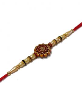 Om Carved RAKHI With Beads and Diamonds on Golden Rings