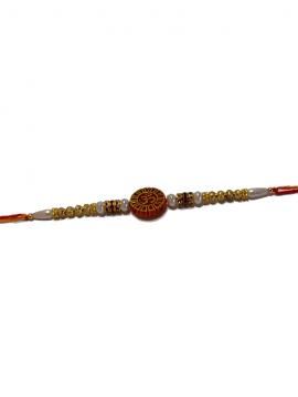 Om Carved RAKHI With Beads and Diamonds