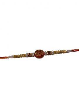 Om Carved RAKHI With Beads and Diamonds