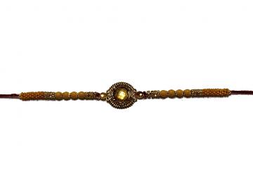 Aesthetic Rakhi W/ a Amber Gem Stone Surrounded in Gold