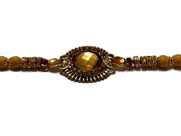 Aesthetic Rakhi W/ a Amber Gem Stone Surrounded in Gold Aesthetic Rakhi W/ a Amber Gem Stone Surrounded in Gold