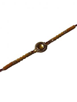Aesthetic Rakhi W/ a Amber Gem Stone Surrounded in Gold Aesthetic Rakhi W/ a Amber Gem Stone Surrounded in Gold