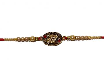 Antique Rakhi in Gold Surrounded with White Pearls