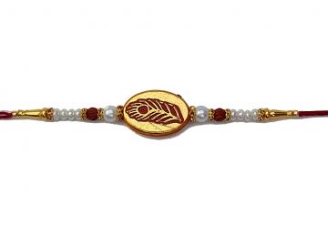 Peacock Feather Carved in Gold RAKHI with Rudraksha and White Beads Peacock Feather Carved in Gold RAKHI with Rudraksha and White Beads