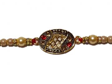 Antique Rakhi in Gold Surrounded with White Pearls