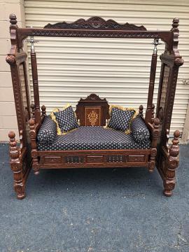 Carved wooden swing for indoor living room