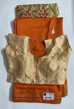 Orange saree and creme readymade blouse