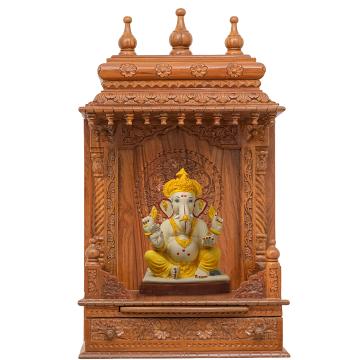 Showing the interior of the Gopura wooden mandir with a diety or spirutal figure displayed Showing the interior of the Gopura wooden mandir with a diety or spirutal figure displayed