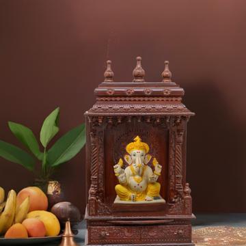 Illustrate the gopura wooden mandir in a lifestyle setting, such as a well-designed living room or prayer room.