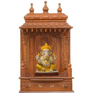Show the interior of the gopura wooden mandir with a deity or spiritual figure prominently displayed.