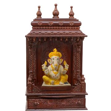 Show the interior of the gopura wooden mandir with a deity or spiritual figure prominently displayed.