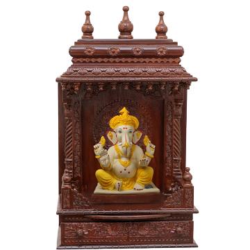 Show the interior of the gopura wooden mandir with a deity or spiritual figure prominently displayed.