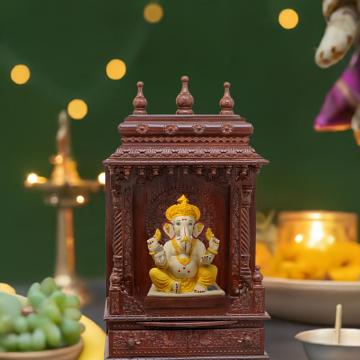 Illustrate the gopura wooden mandir in a lifestyle setting, such as a well-designed living room or prayer room