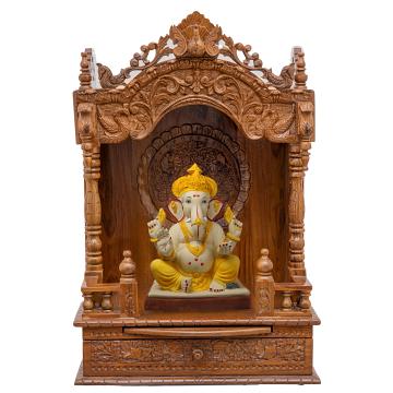 Show the interior of the mandap wooden mandir with a deity or spiritual figure prominently displayed.