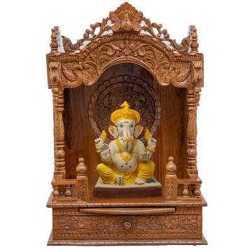 Show the interior of the mandap wooden mandir with a deity or spiritual figure prominently displayed.