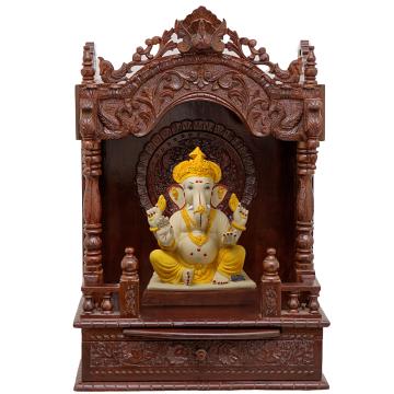 Show the interior of the mandap wooden mandir with a deity or spiritual figure prominently displayed.