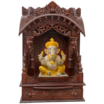 Show the interior of the torana wooden mandir with a deity or spiritual figure prominently displayed. Show the interior of the torana wooden mandir with a deity or spiritual figure prominently displayed.