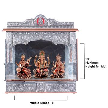 Show the interior of the copper oxidized mandir with a deity or spiritual figure prominently displayed.