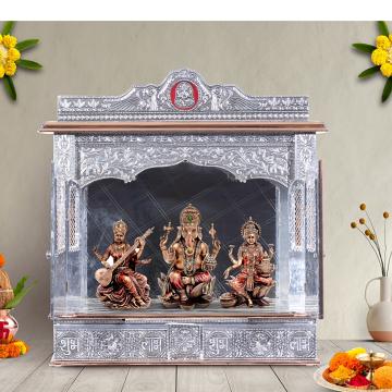 Illustrate the copper oxidized mandir in a lifestyle setting, such as a well-designed living room or prayer room
