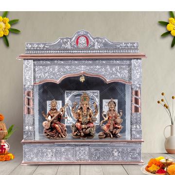 Illustrate the copper oxidized mandir in a lifestyle setting, such as a well-designed living room or prayer room
