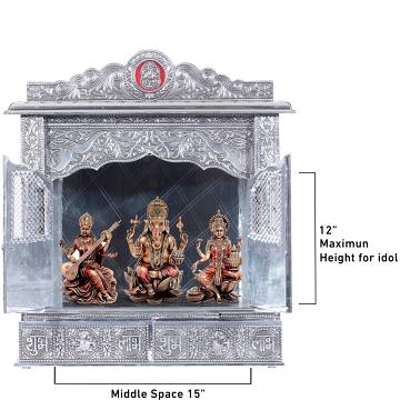 Show the interior of the White Oxidized Home Pooja Mandir with a deity or spiritual figure prominently displayed.