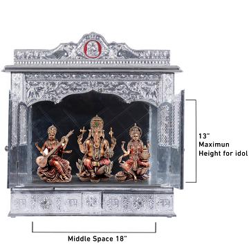 Show the interior of the Pure Silver Color Mandir with a deity or spiritual figure prominently displayed.