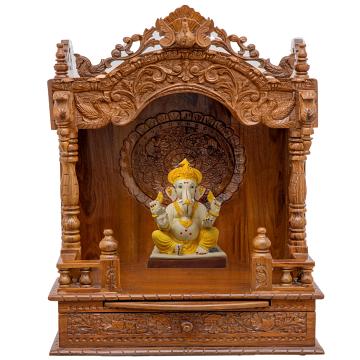 Show the interior of the mandap wooden mandir with a deity or spiritual figure prominently displayed.