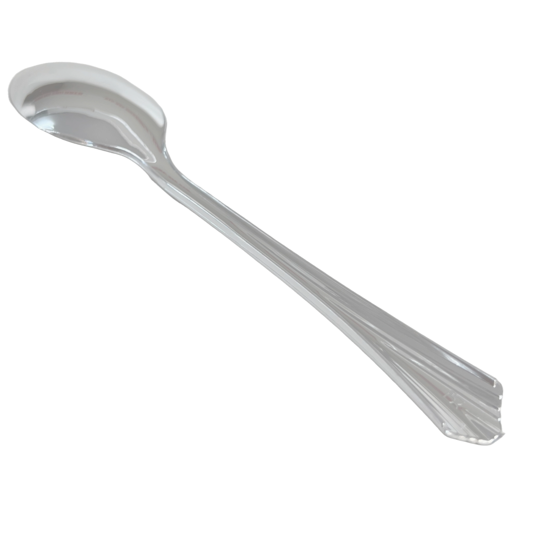 The back of a polished silver spoon, highlighting the smooth surface and elegant curve of the handle.