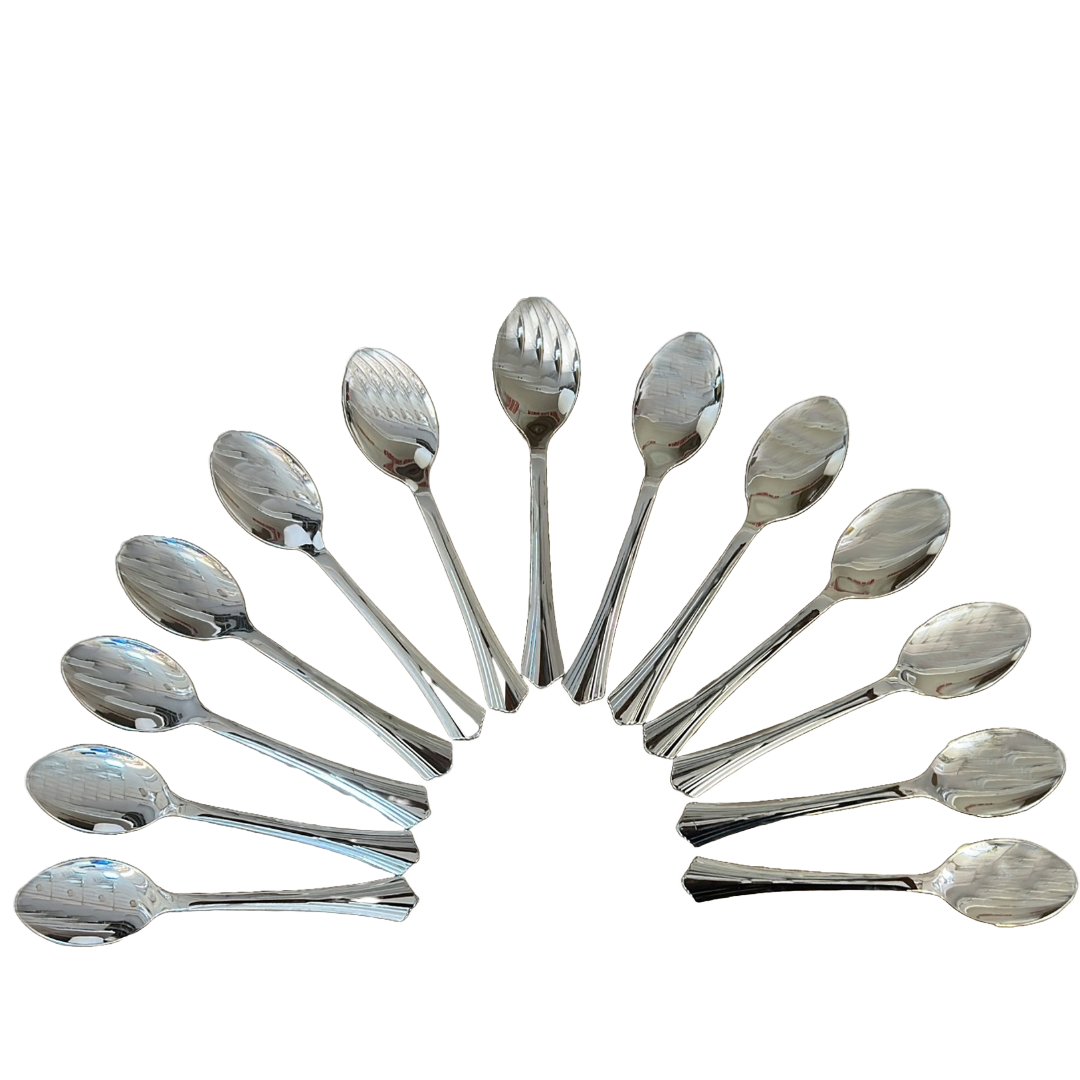 A creative arrangement of silver spoons, fanned out in an arch formation, demonstrating the symmetry and precision in the spoon design.