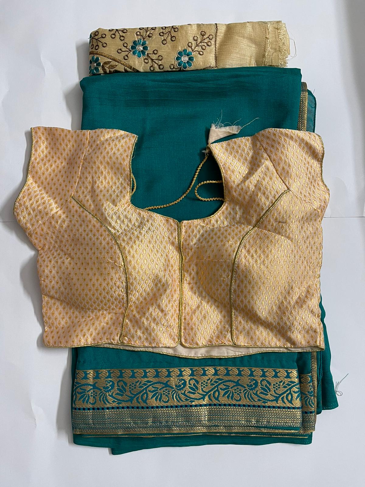 Green saree and creme readymade blouse