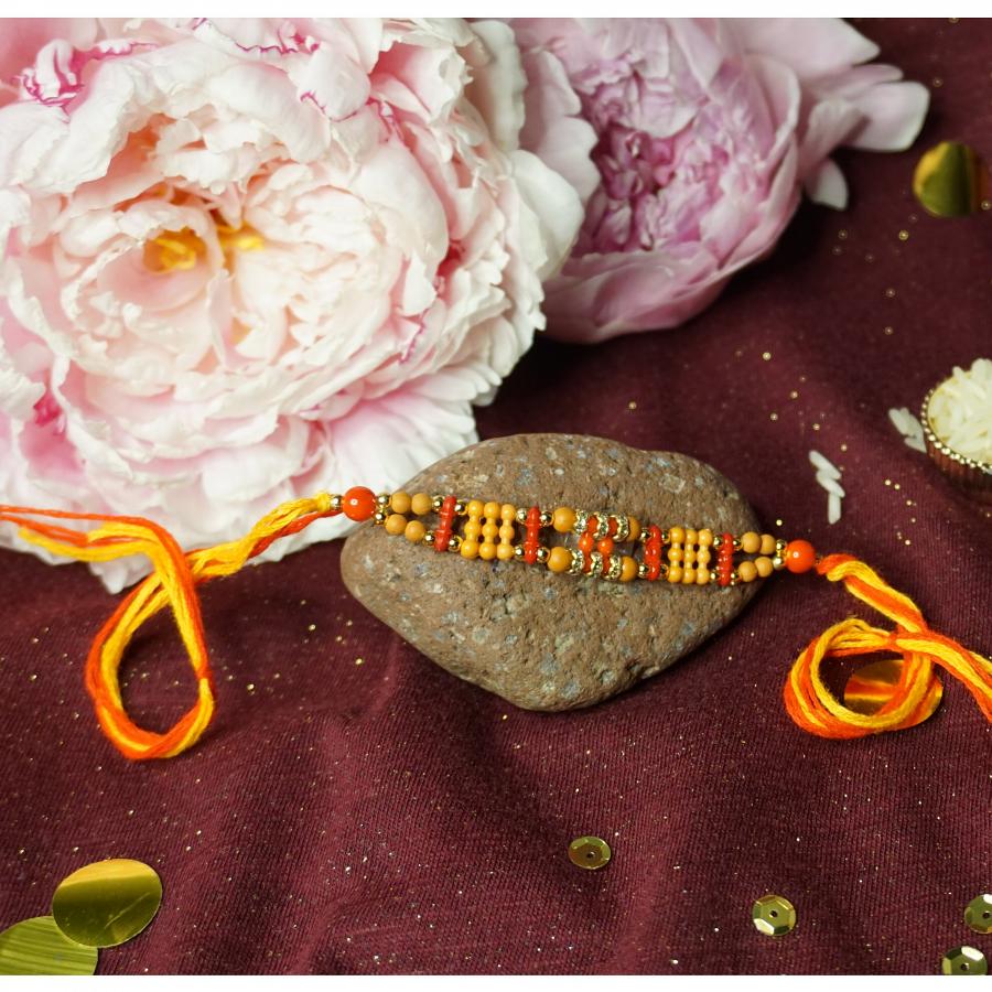 Aesthetic Rakhi with Red & Orange Beads + Roli & Chaval
