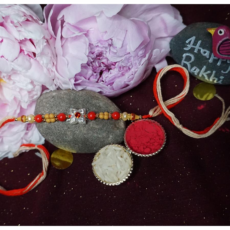 Diamond Flower Rakhi With illuminating Beads and Roli + Chaval Diamond Flower Rakhi With illuminating Beads and Roli + Chaval