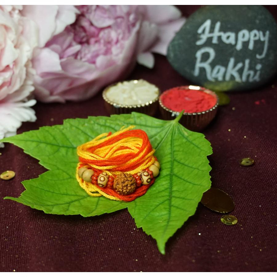 Traditional RAKHI Crafted W/ Rudraksha and Wooden Beads + Roli & Chaval Traditional RAKHI Crafted W/ Rudraksha and Wooden Beads + Roli & Chaval