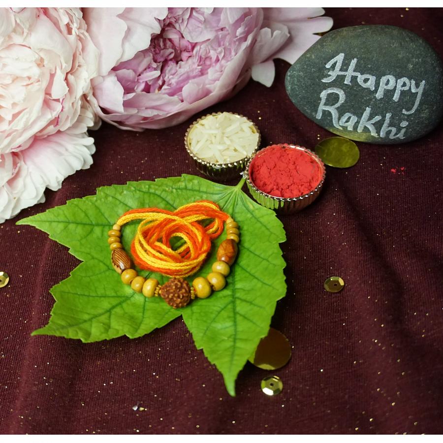Traditional RAKHI Crafted W/ Rudraksha and Wooden Beads + Roli & Chaval Traditional RAKHI Crafted W/ Rudraksha and Wooden Beads + Roli & Chaval